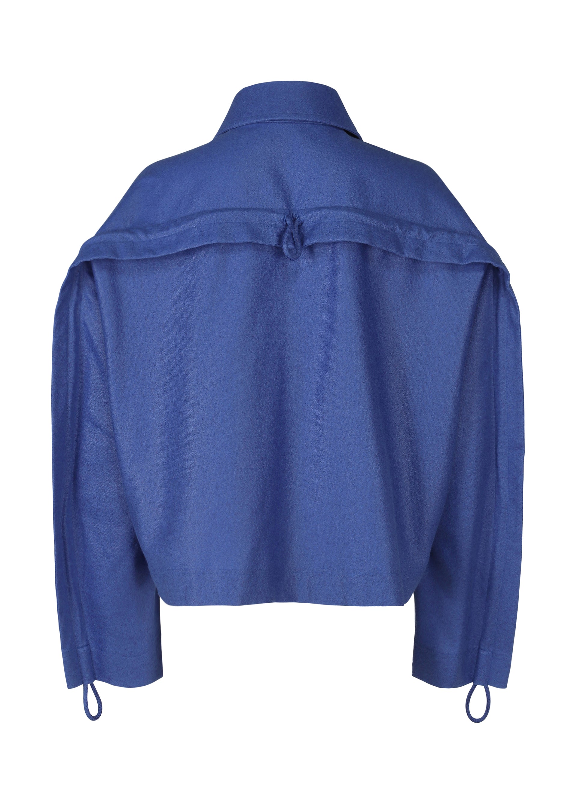 A detail shot of the ISSEY MIYAKE HANG OR CARRY jacket.