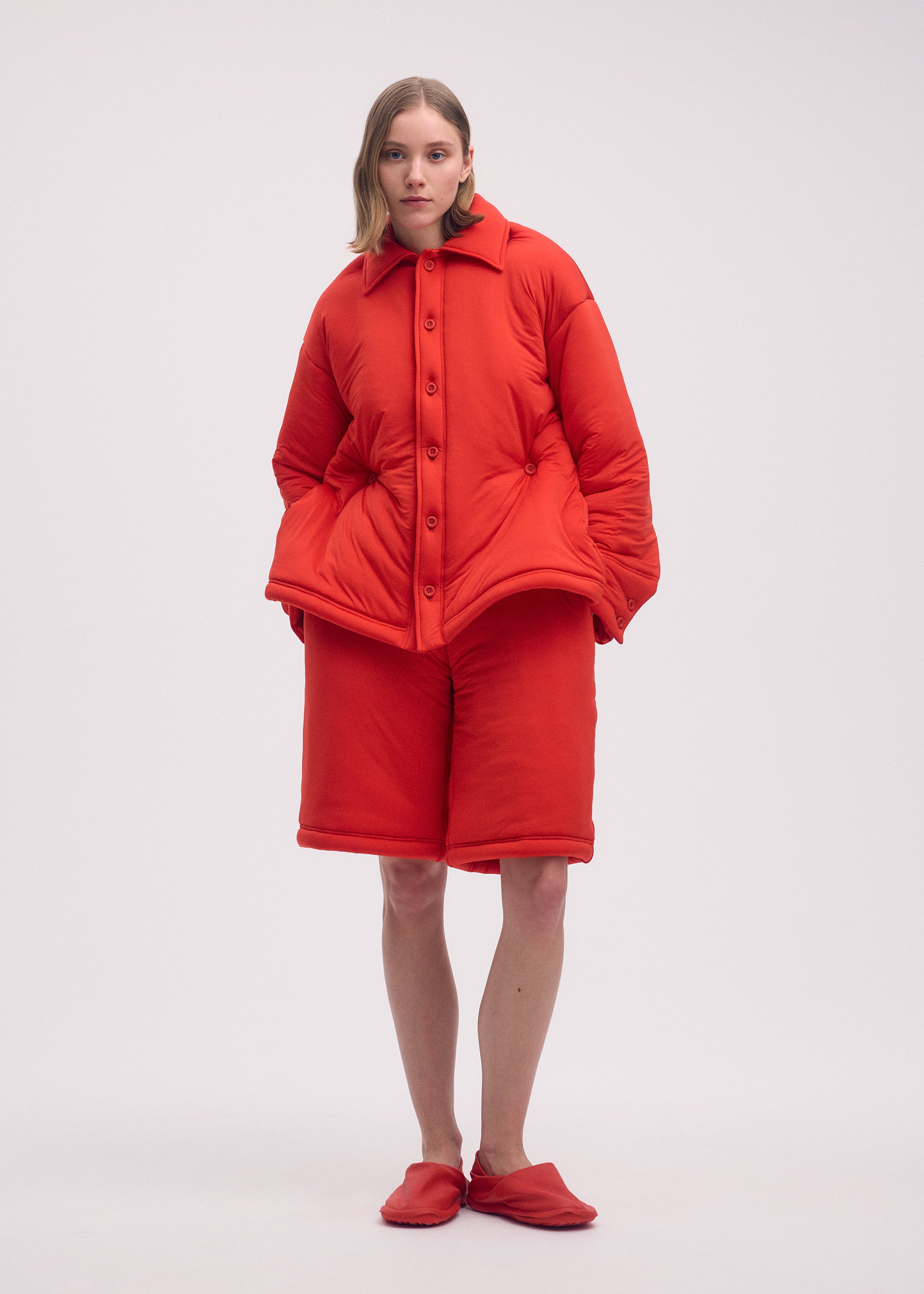 A model wears the ISSEY MIYAKE PUMPED T trousers.
