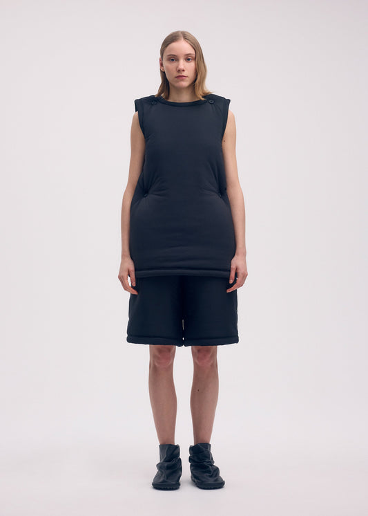 A model wears the ISSEY MIYAKE PUMPED T tunic.