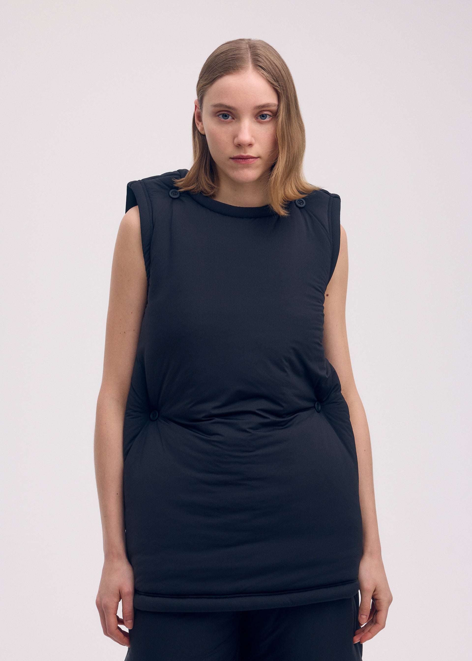 A model wears the ISSEY MIYAKE PUMPED T tunic.
