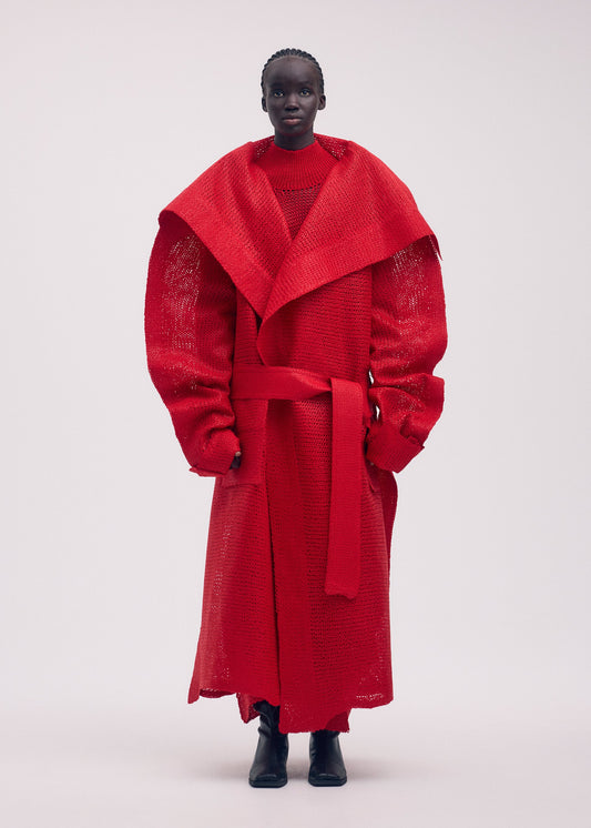 A model wears the ISSEY MIYAKE PANINI coat.