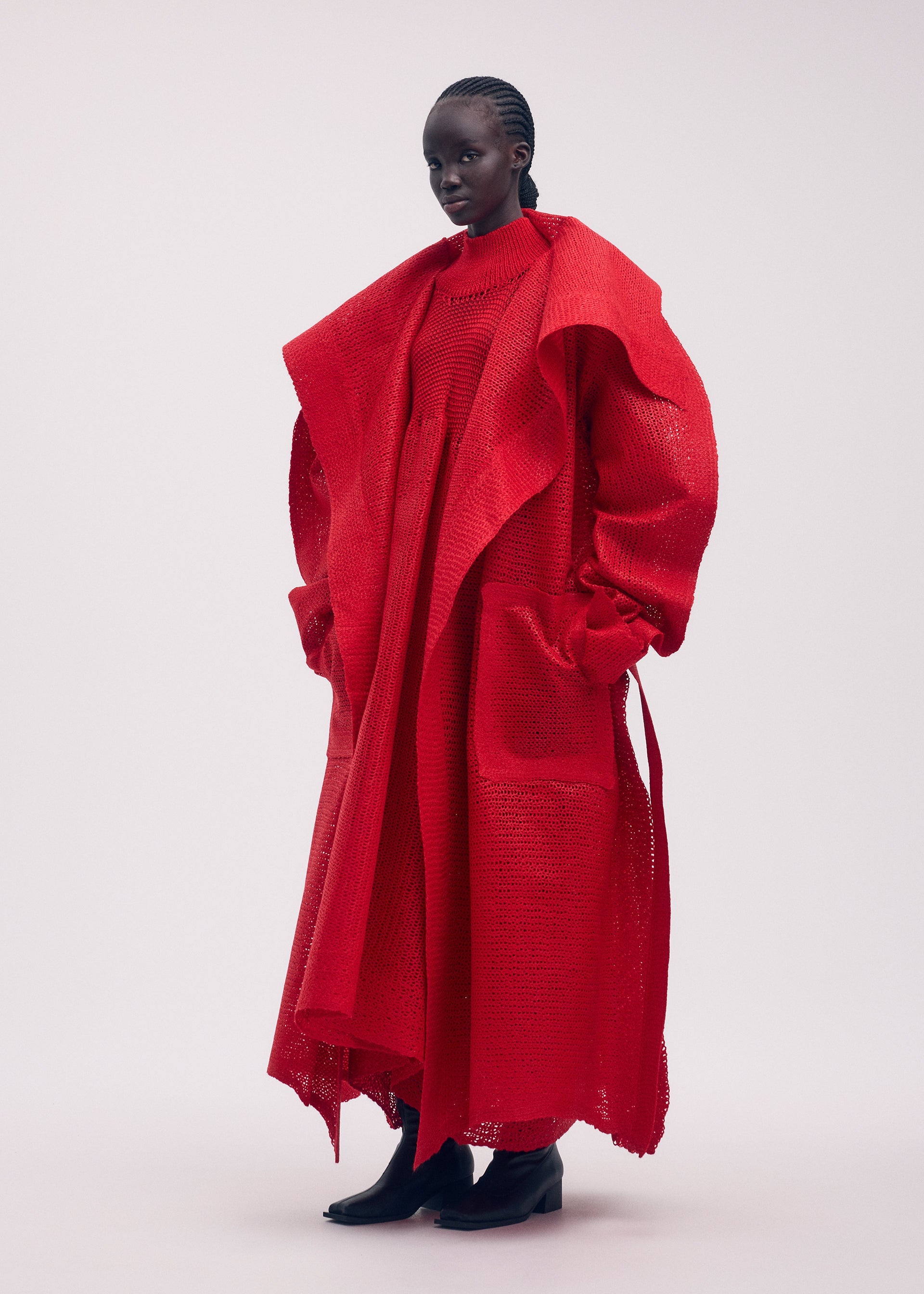 A model wears the ISSEY MIYAKE PANINI coat.
