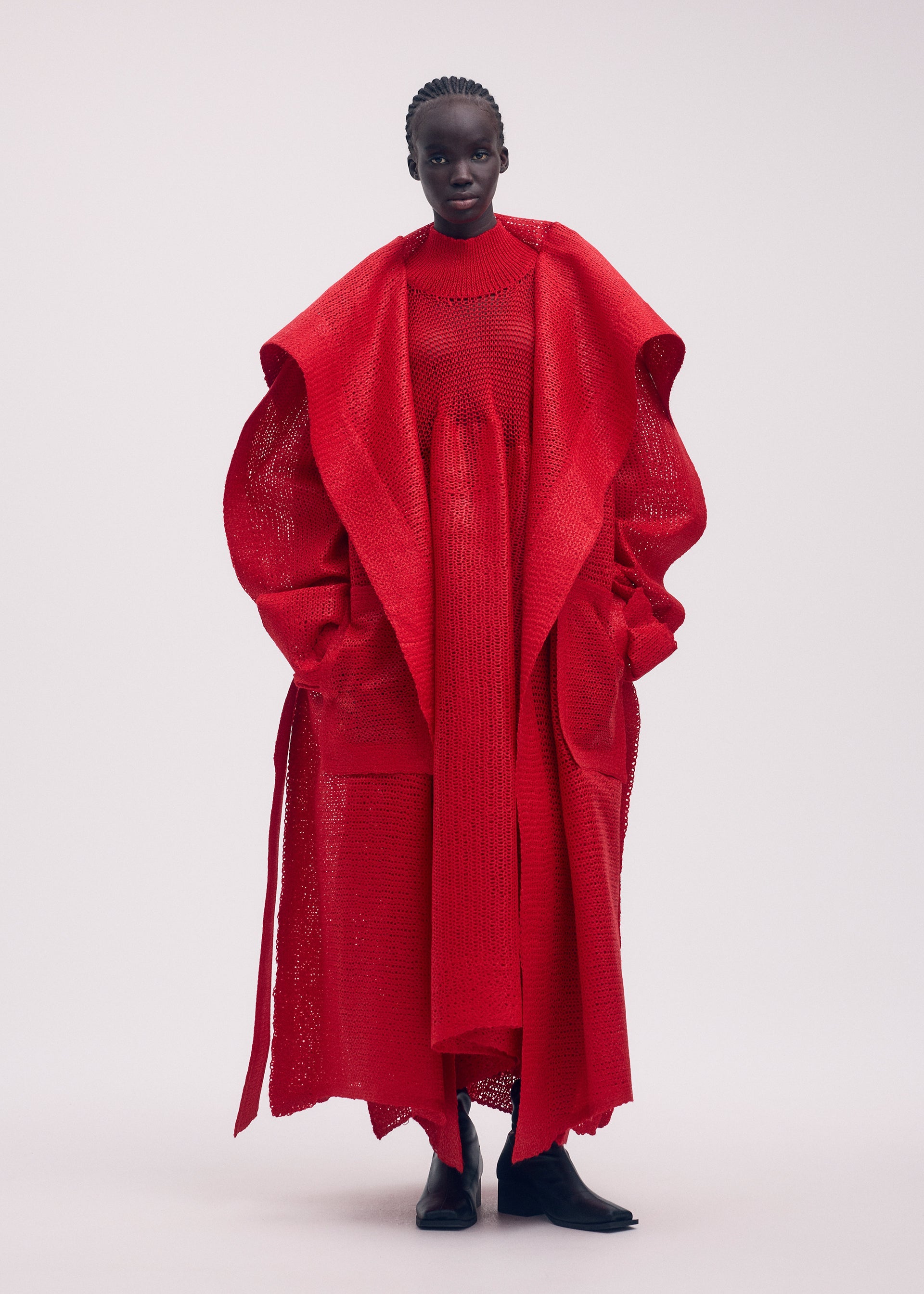 A model wears the ISSEY MIYAKE PANINI coat.