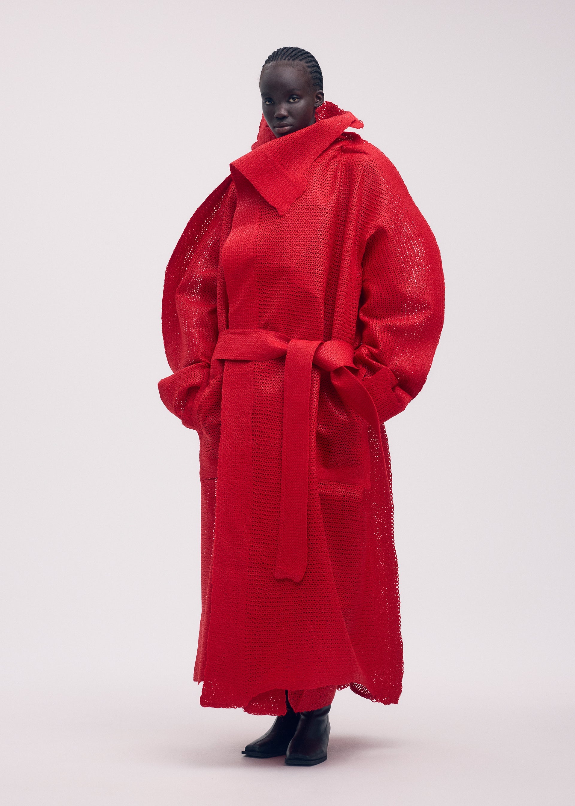 A model wears the ISSEY MIYAKE PANINI coat.