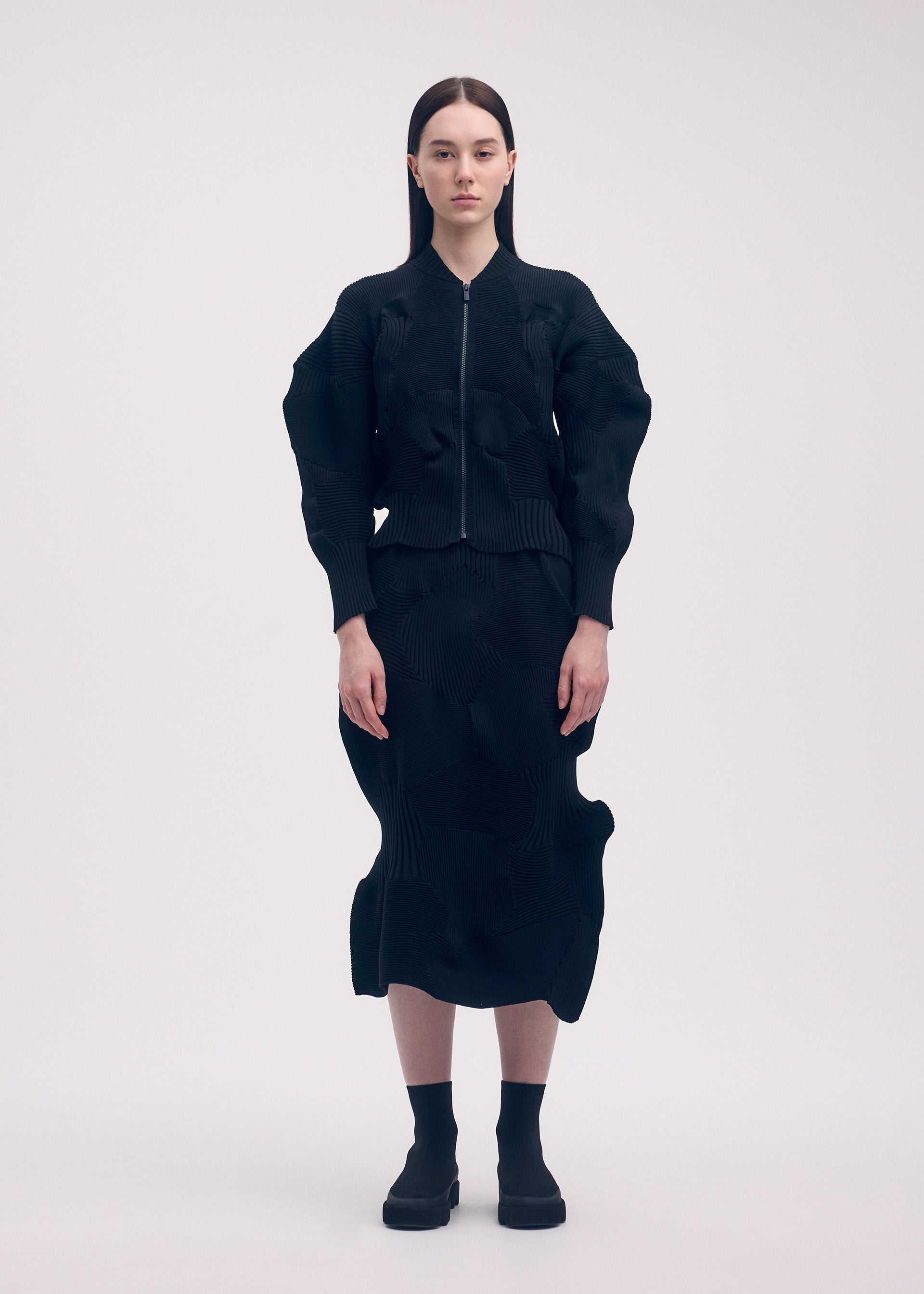 A model wears the ISSEY MIYAKE KONE KONE jacket.