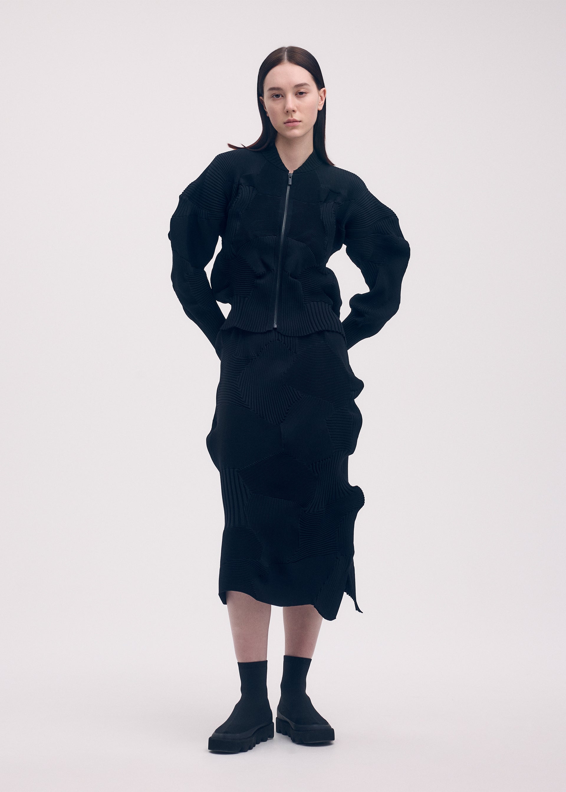 A model wears the ISSEY MIYAKE KONE KONE jacket.