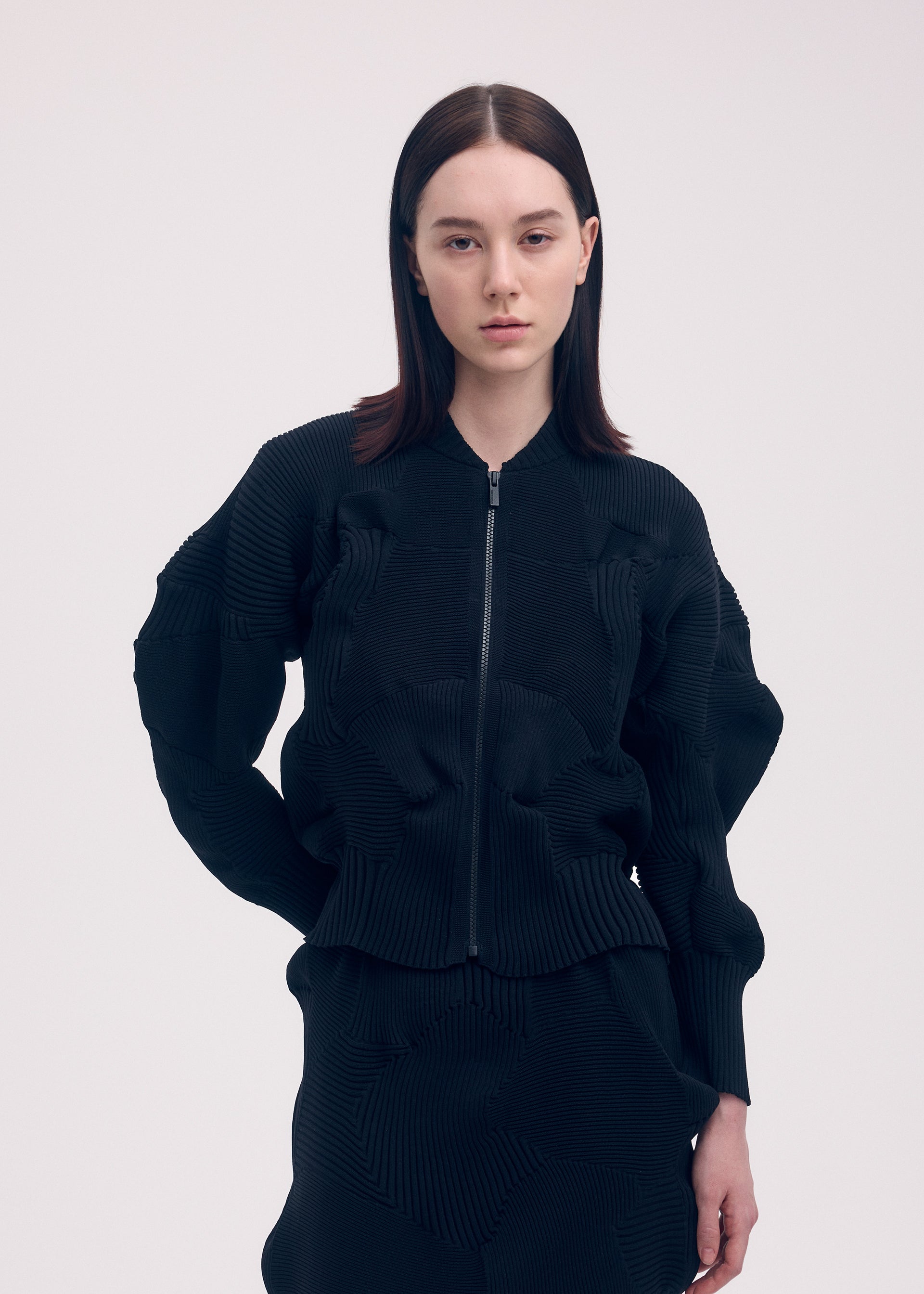 A model wears the ISSEY MIYAKE KONE KONE jacket.