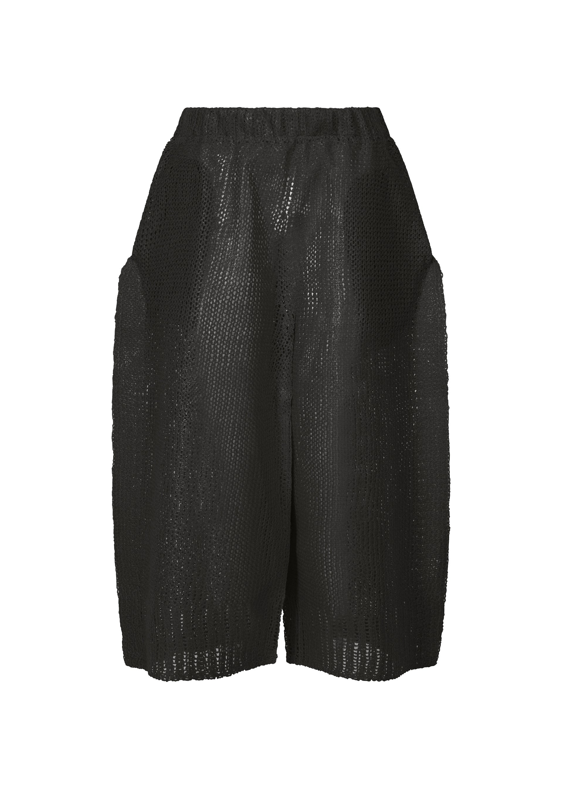 A product shot of the ISSEY MIYAKE PANINI trousers in black (15).
