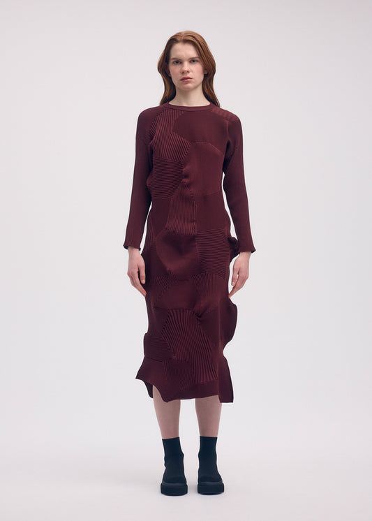 A model wears the ISSEY MIYAKE KONE KONE dress.