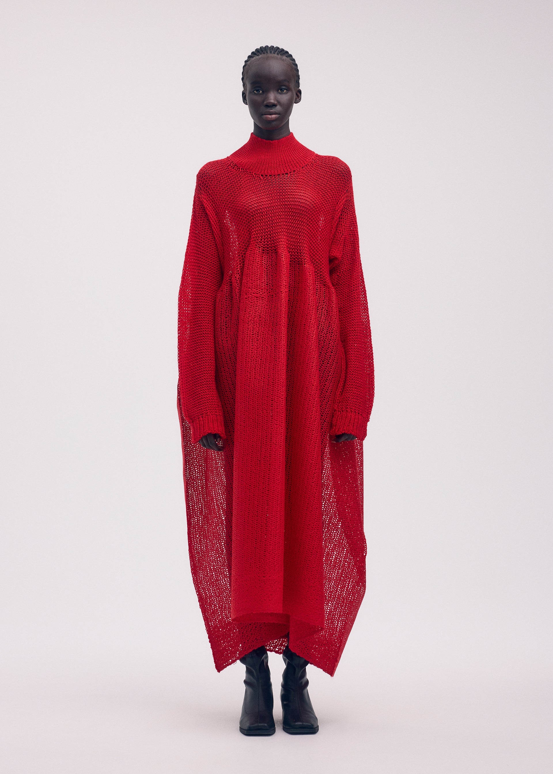 A model wears the ISSEY MIYAKE PANINI dress.