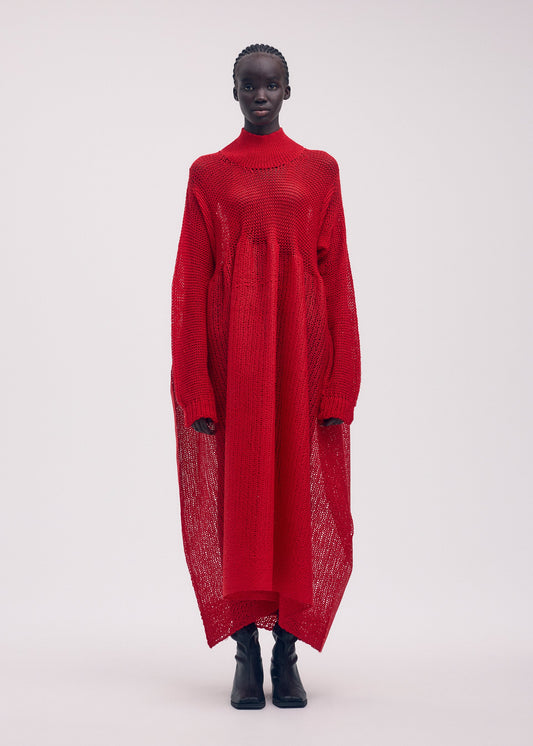 A model wears the ISSEY MIYAKE PANINI dress.