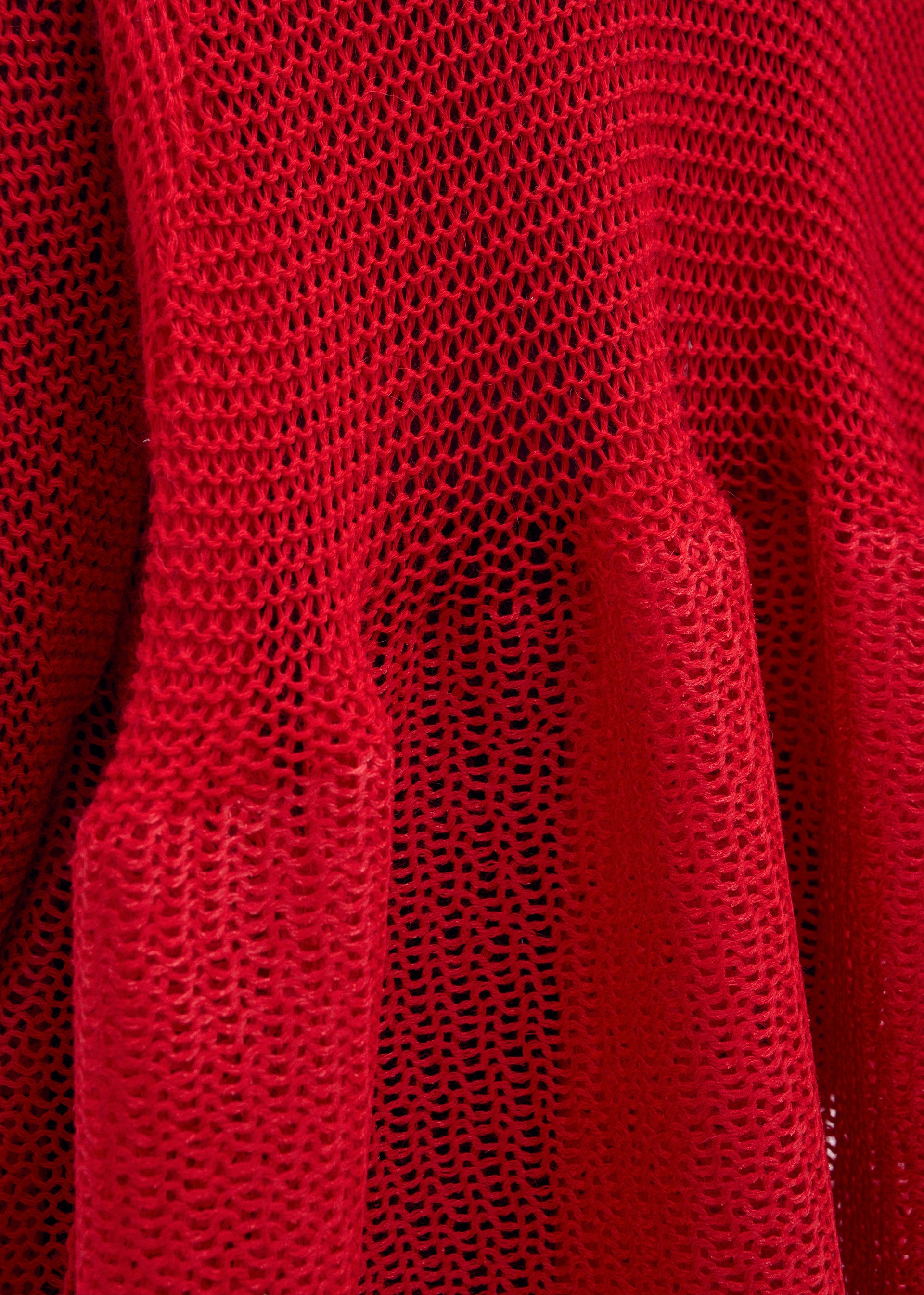 A model wears the ISSEY MIYAKE PANINI dress.