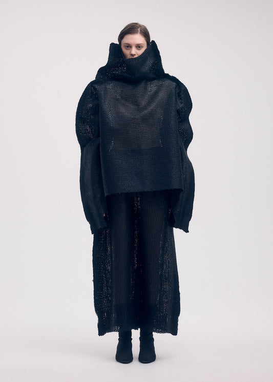 A model wears the ISSEY MIYAKE PANINI top.