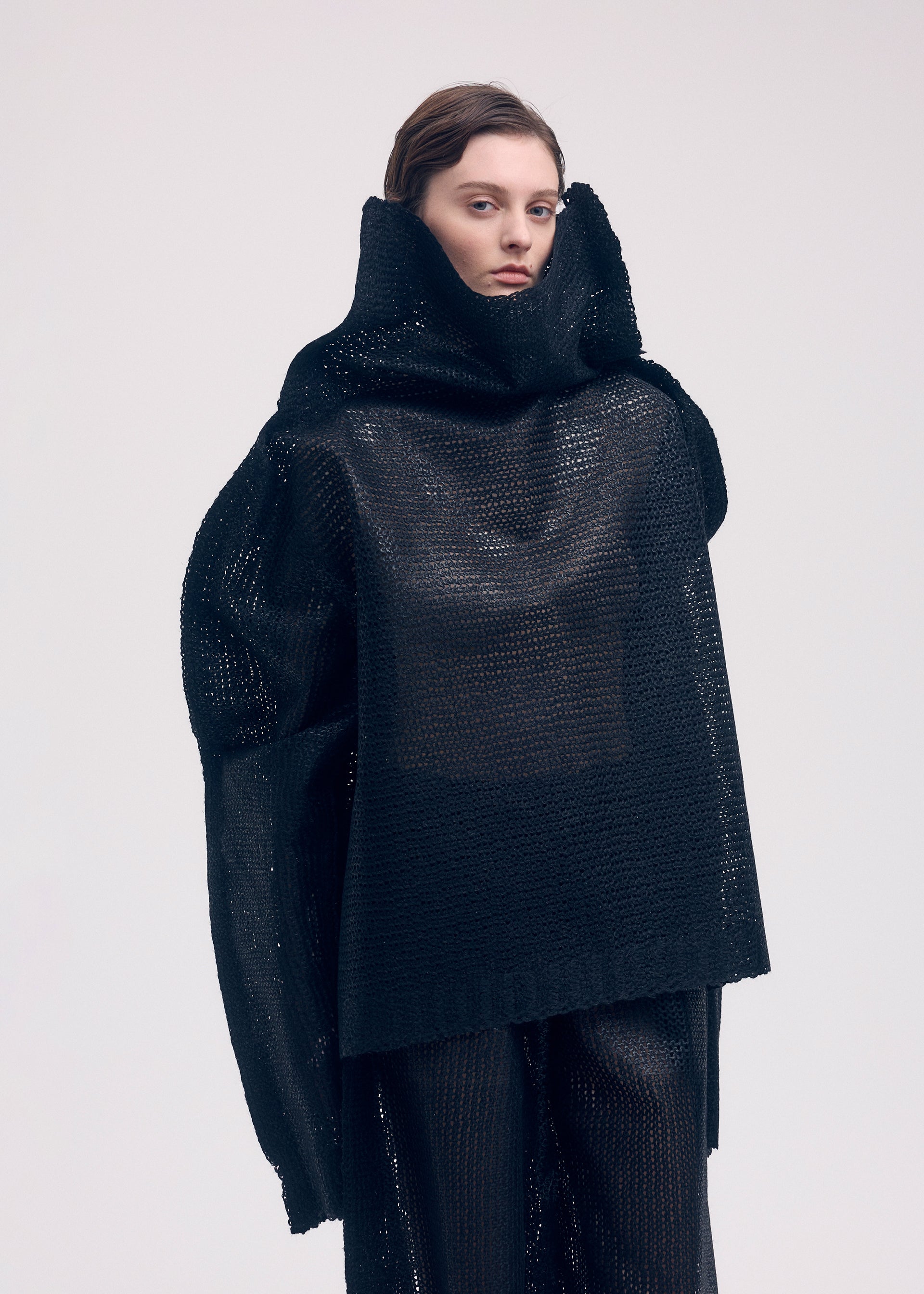 A model wears the ISSEY MIYAKE PANINI top.
