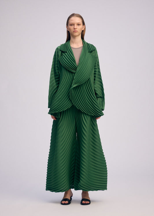 A model wears the ISSEY MIYAKE CIRCLE PLEATS PB jacket.