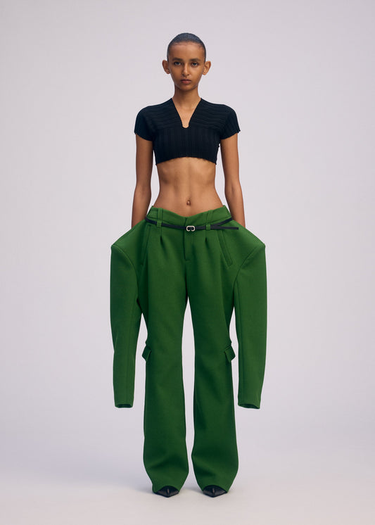 A model wears the ISSEY MIYAKE ARMS clothing.