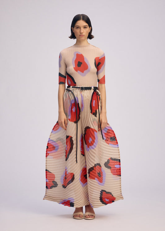 A model wears the ISSEY MIYAKE VERVE trousers.