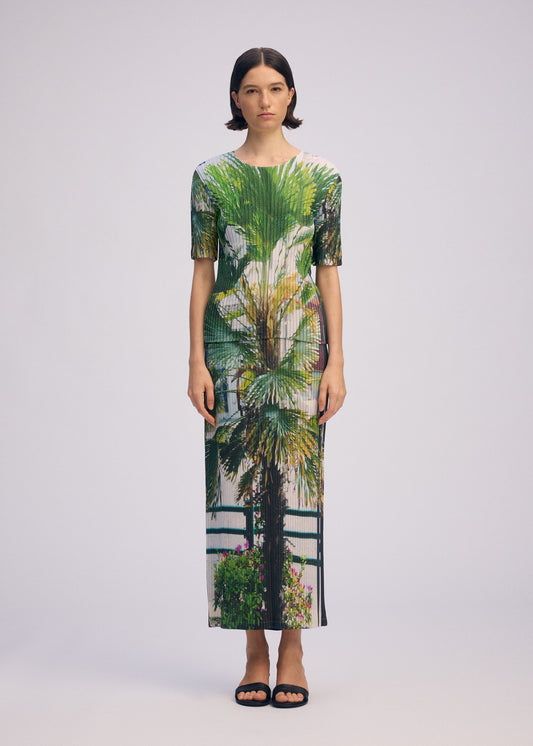 A model wears the ISSEY MIYAKE URBAN JUNGLE PLEATS skirt.