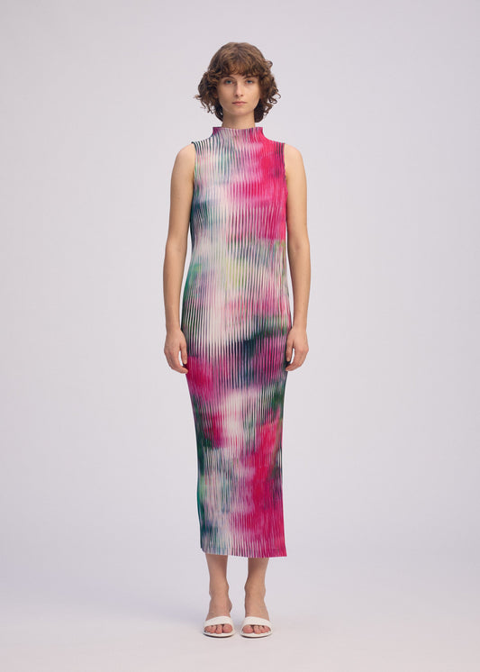 A model wears the ISSEY MIYAKE OBSCURE PLEATS clothing.