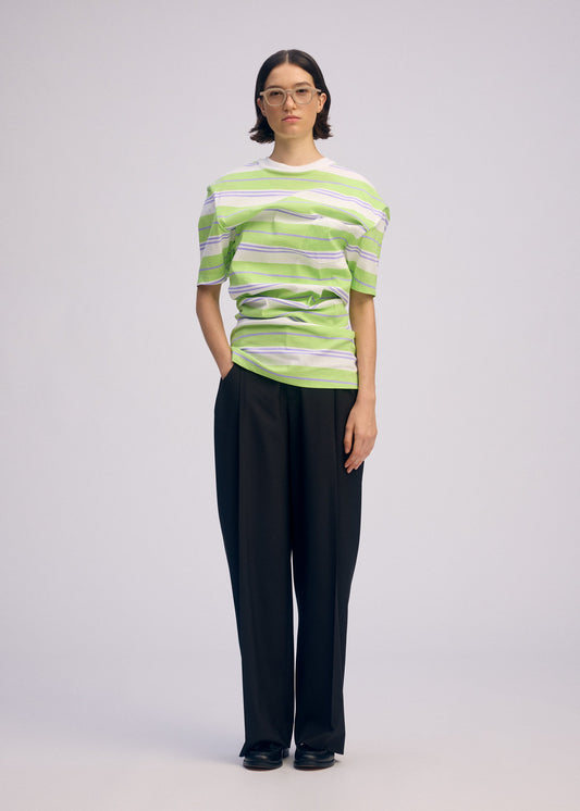 A model wears the ISSEY MIYAKE GENERIC WEAR STRIPES shirt.