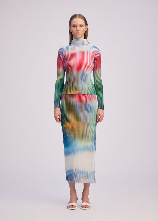A model wears the ISSEY MIYAKE OBSCURE PLEATS clothing.