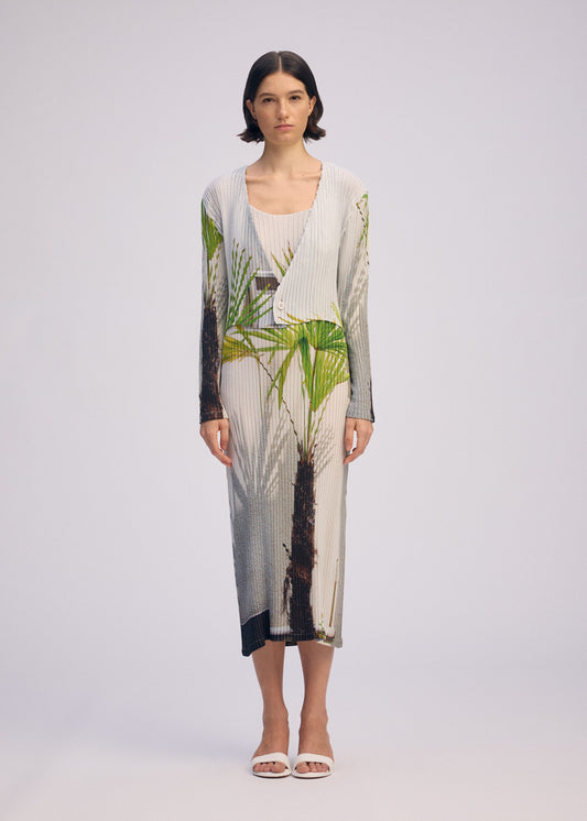 A model wears the ISSEY MIYAKE URBAN JUNGLE PLEATS cardigan.