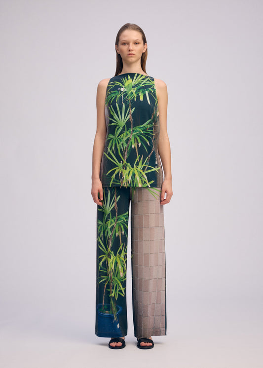 A model wears the ISSEY MIYAKE URBAN JUNGLE JERSEY shirt.