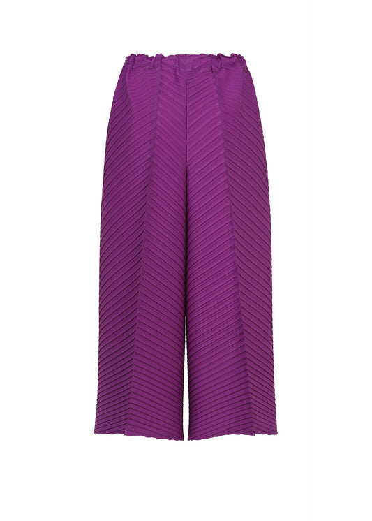 A detail shot of the ISSEY MIYAKE TUBULAR PLEATS trousers.