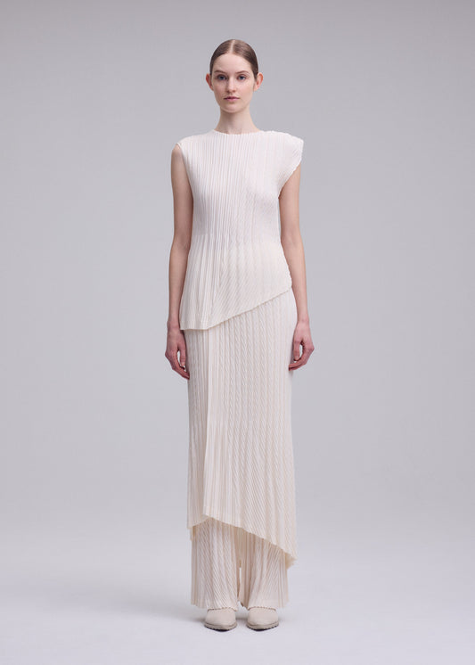 A model wears the ISSEY MIYAKE UNFURLING PLEATS top.