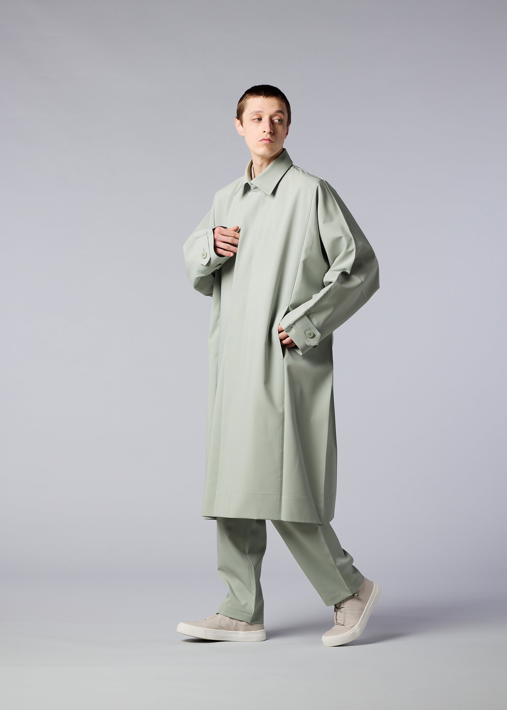 A model wears the IM MEN FLAT coat