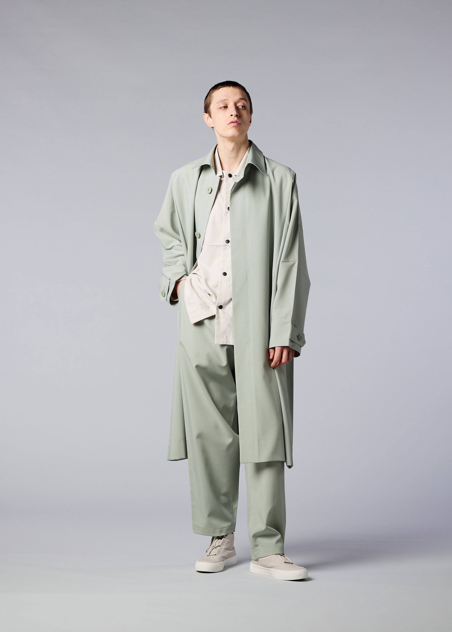 A model wears the IM MEN FLAT coat
