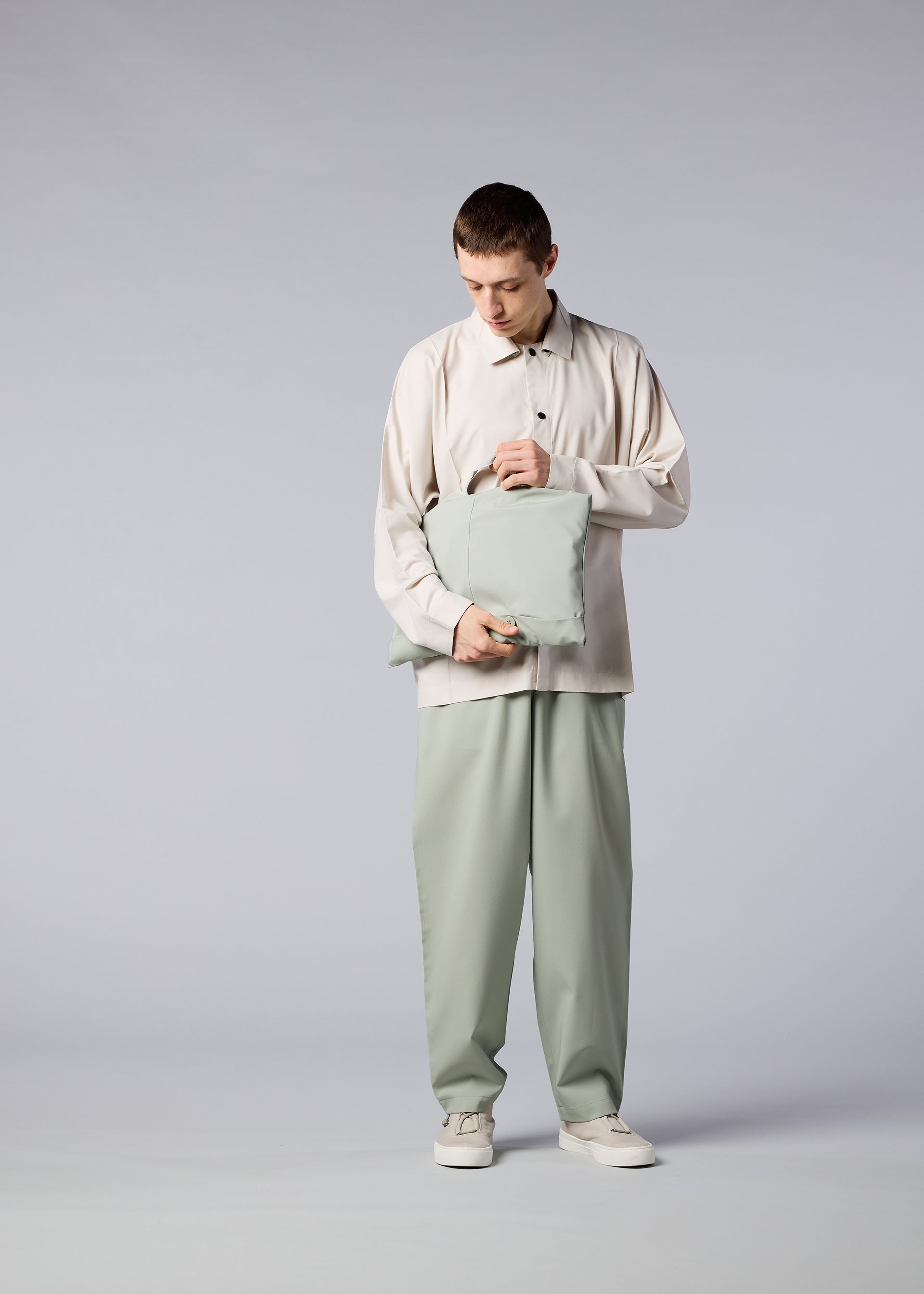 A model wears the IM MEN FLAT coat