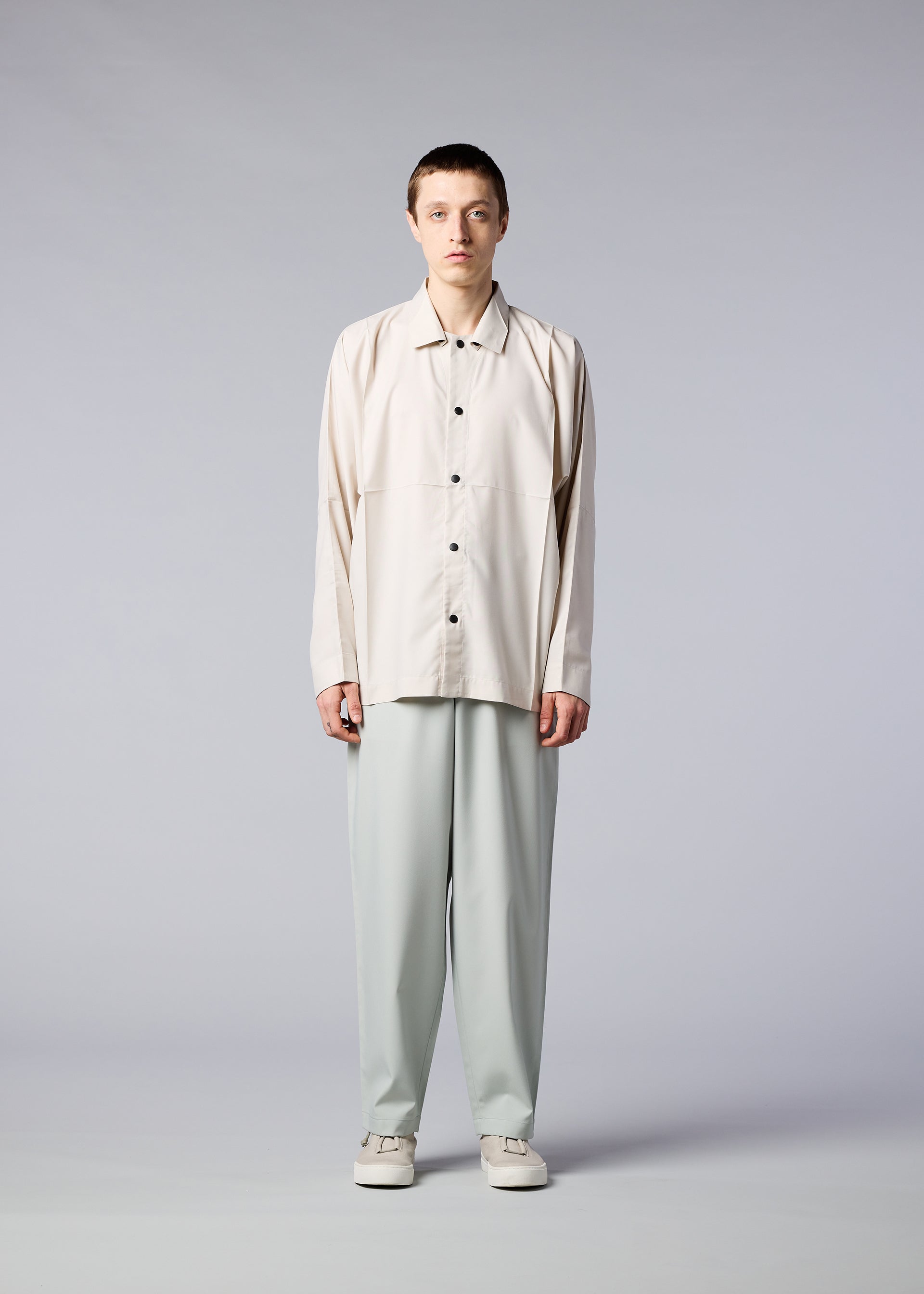 A model wears the IM MEN FLAT trousers