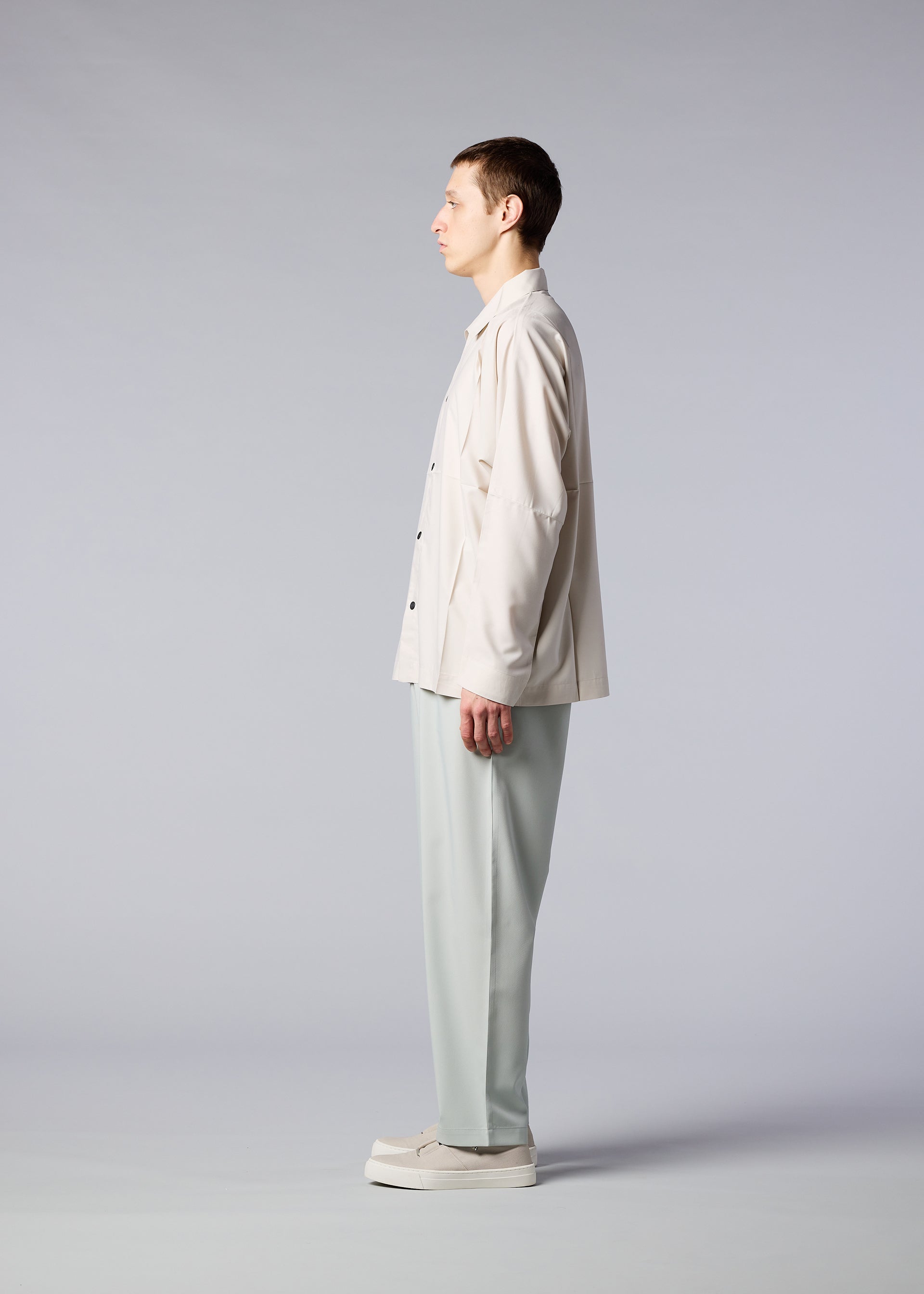 A model wears the IM MEN FLAT trousers
