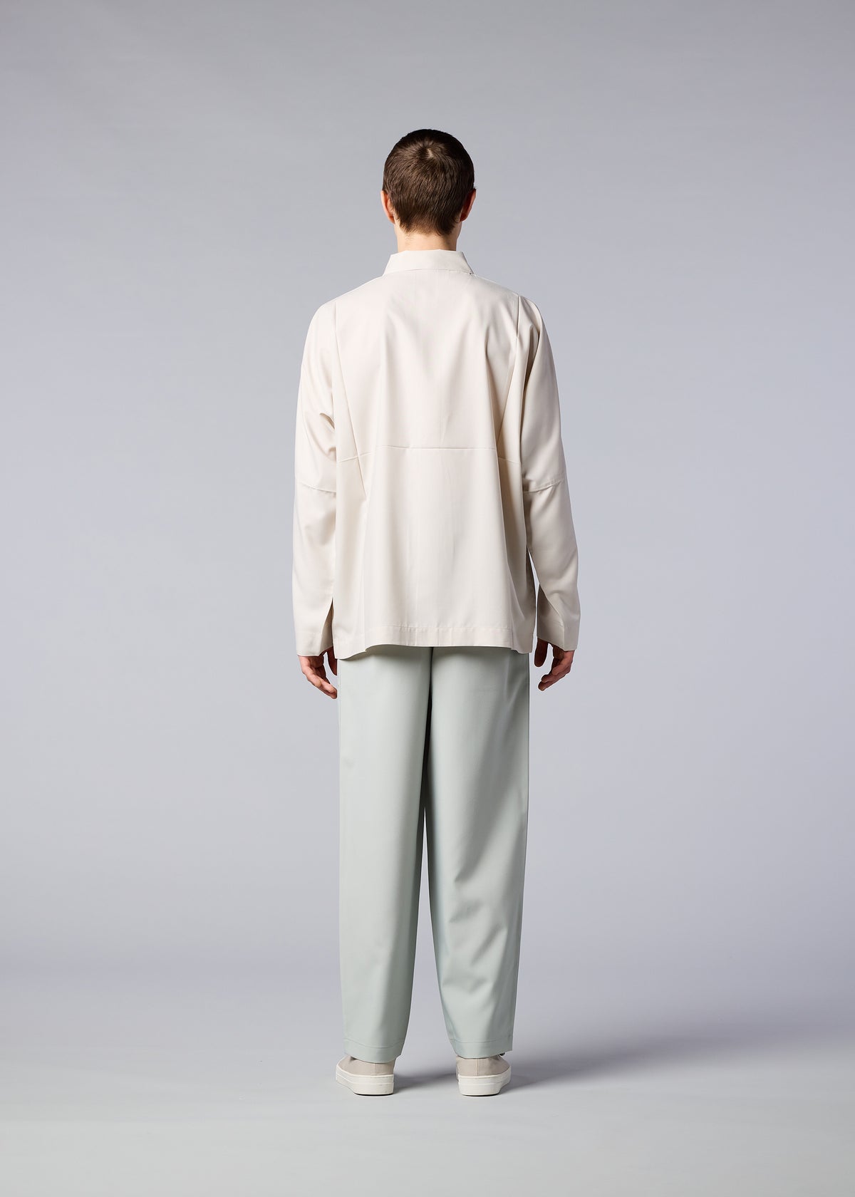 A model wears the IM MEN FLAT trousers