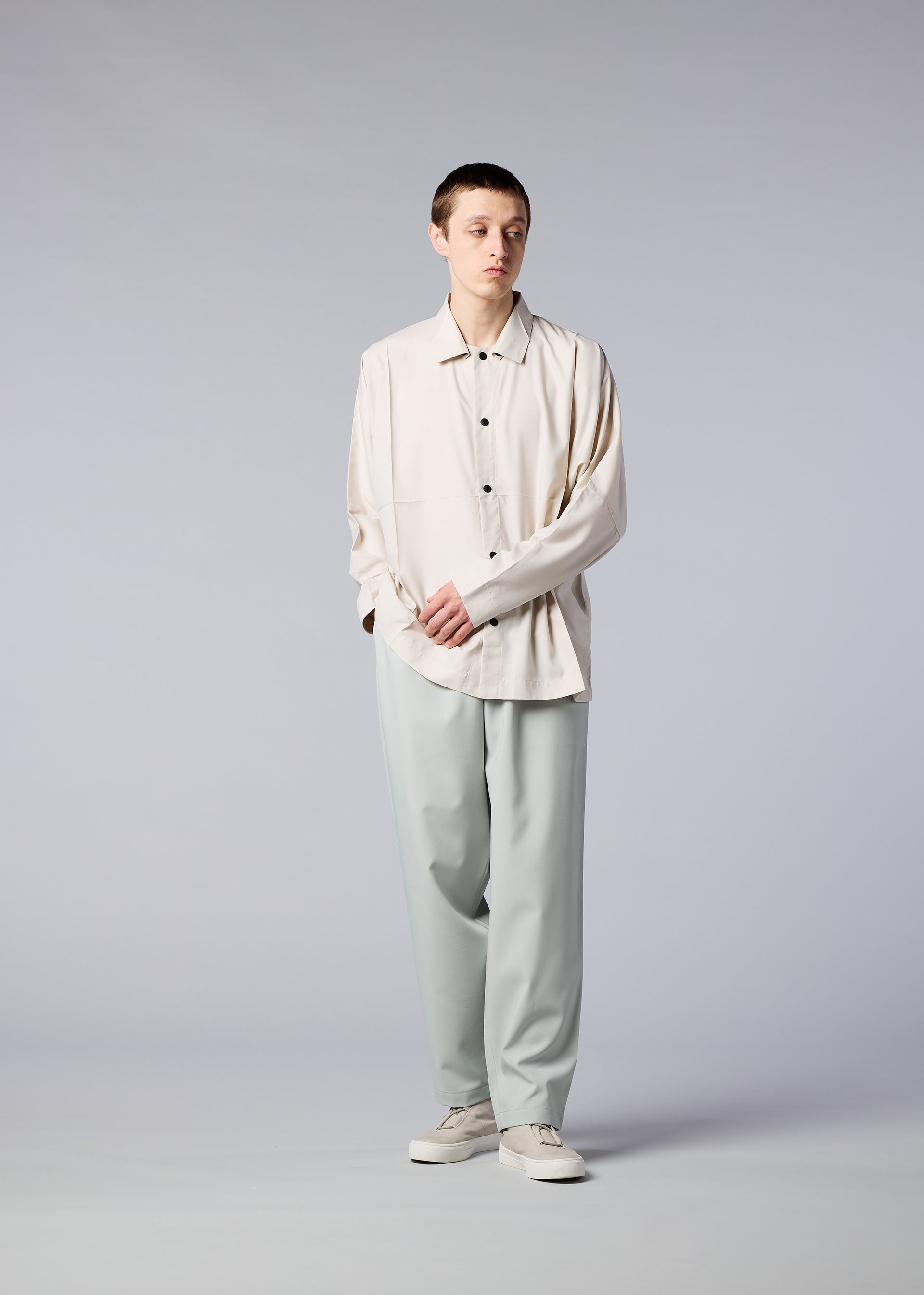 A model wears the IM MEN FLAT trousers