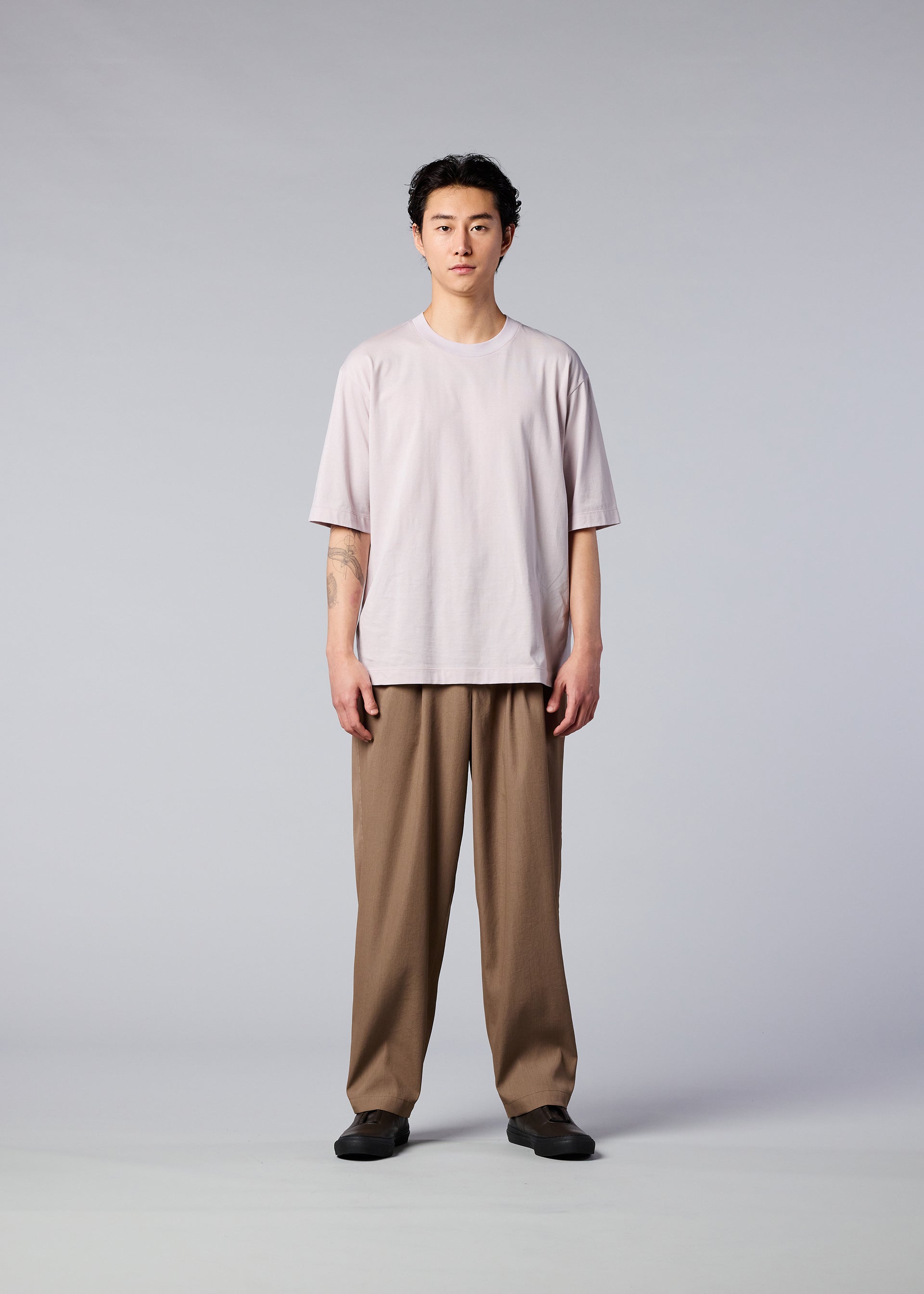 A model wears the IM MEN AIR trousers