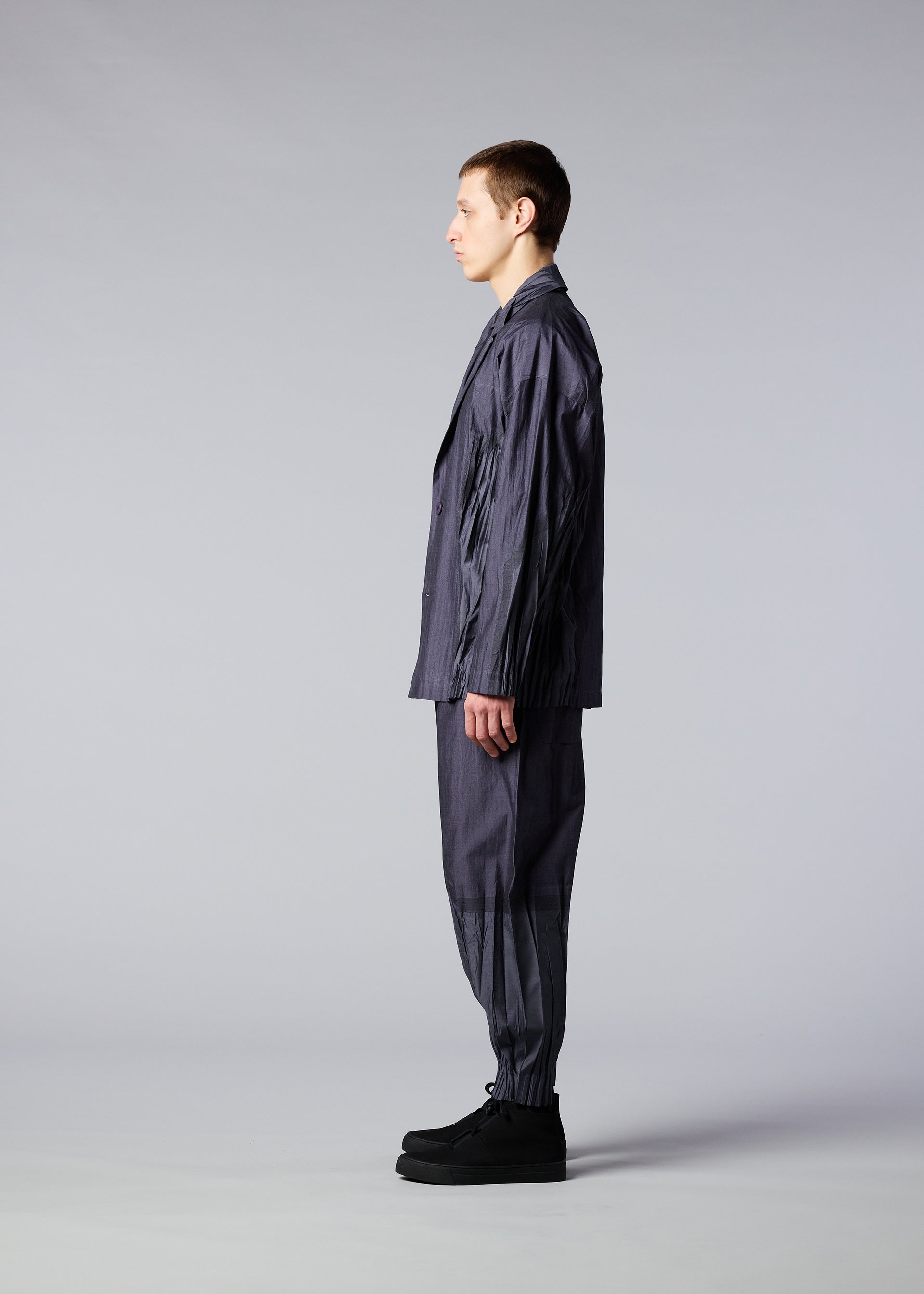A model wears the IM MEN DUO trousers