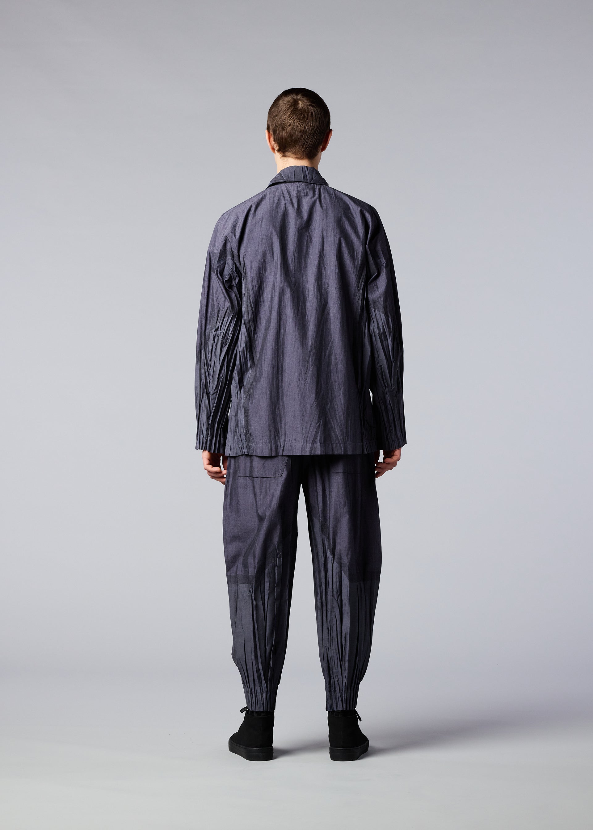 A model wears the IM MEN DUO trousers