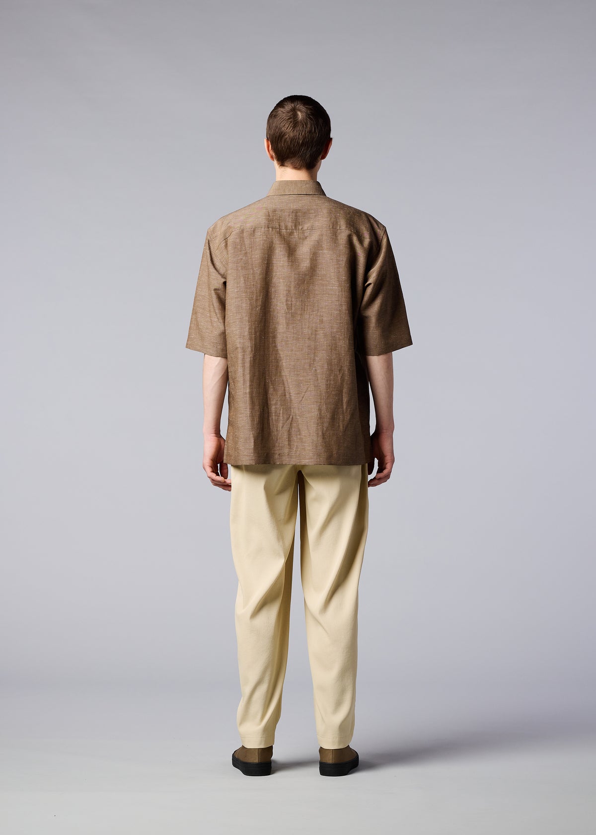 A model wears the IM MEN HYBRID SHIRT shirt