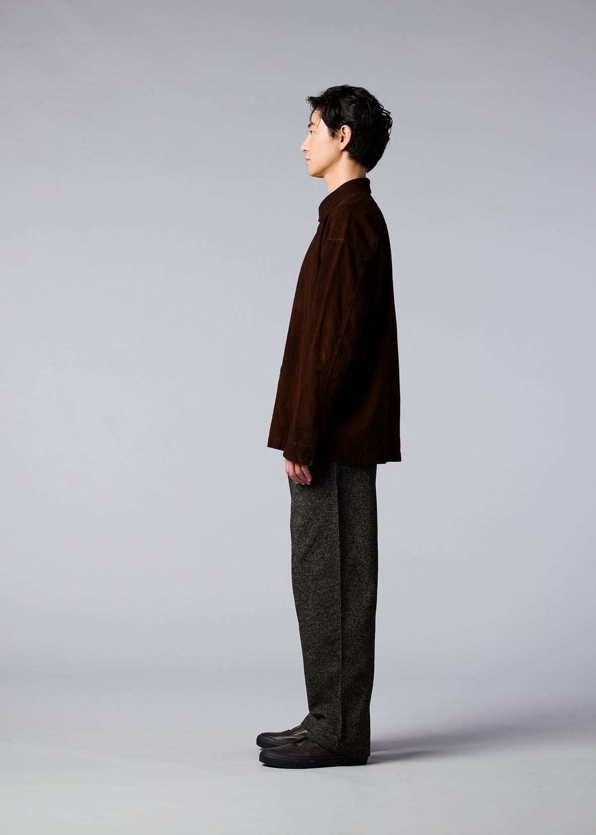A model wears the IM MEN DOROZOME SHIRT shirt.