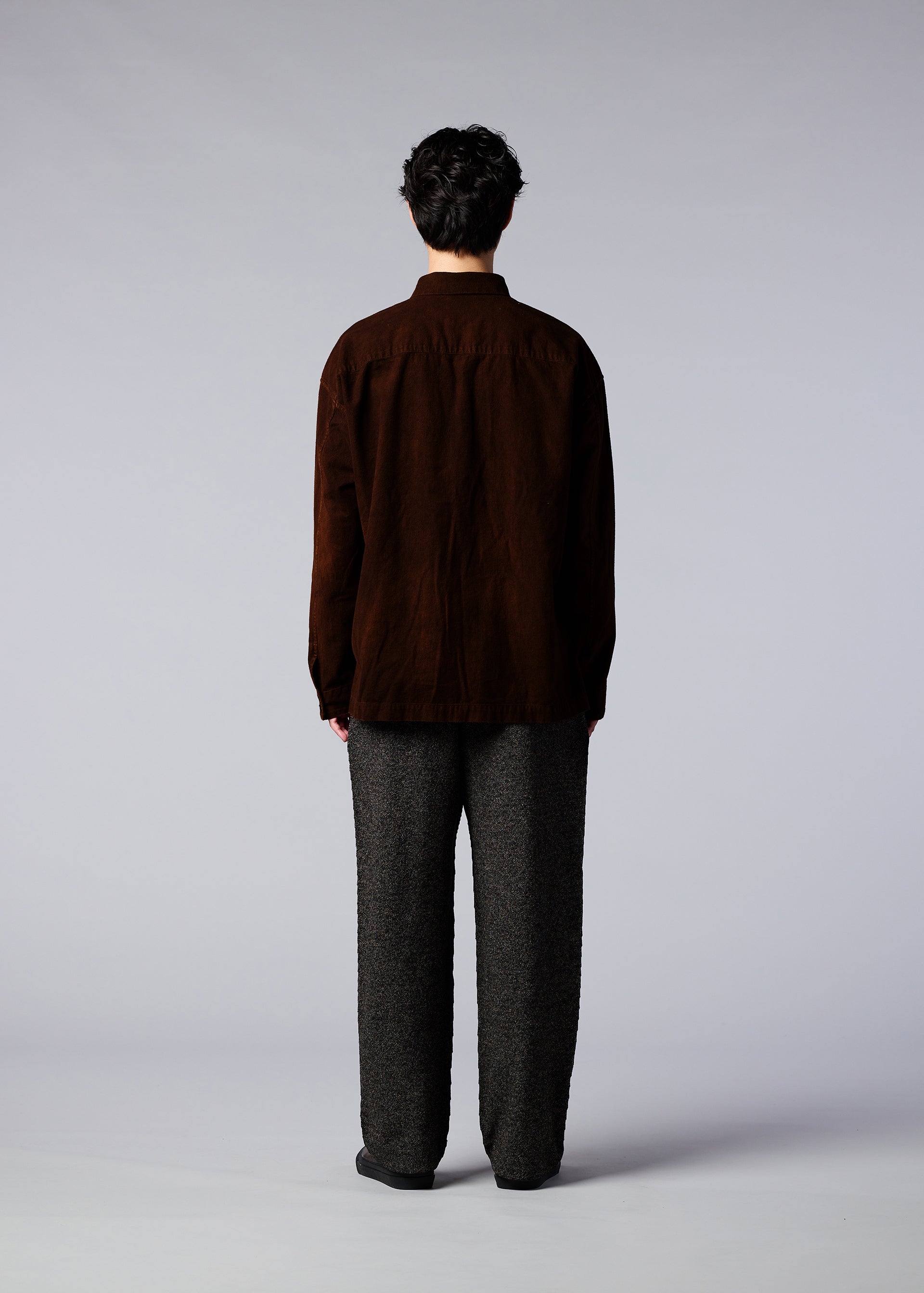 A model wears the IM MEN DOROZOME SHIRT shirt.