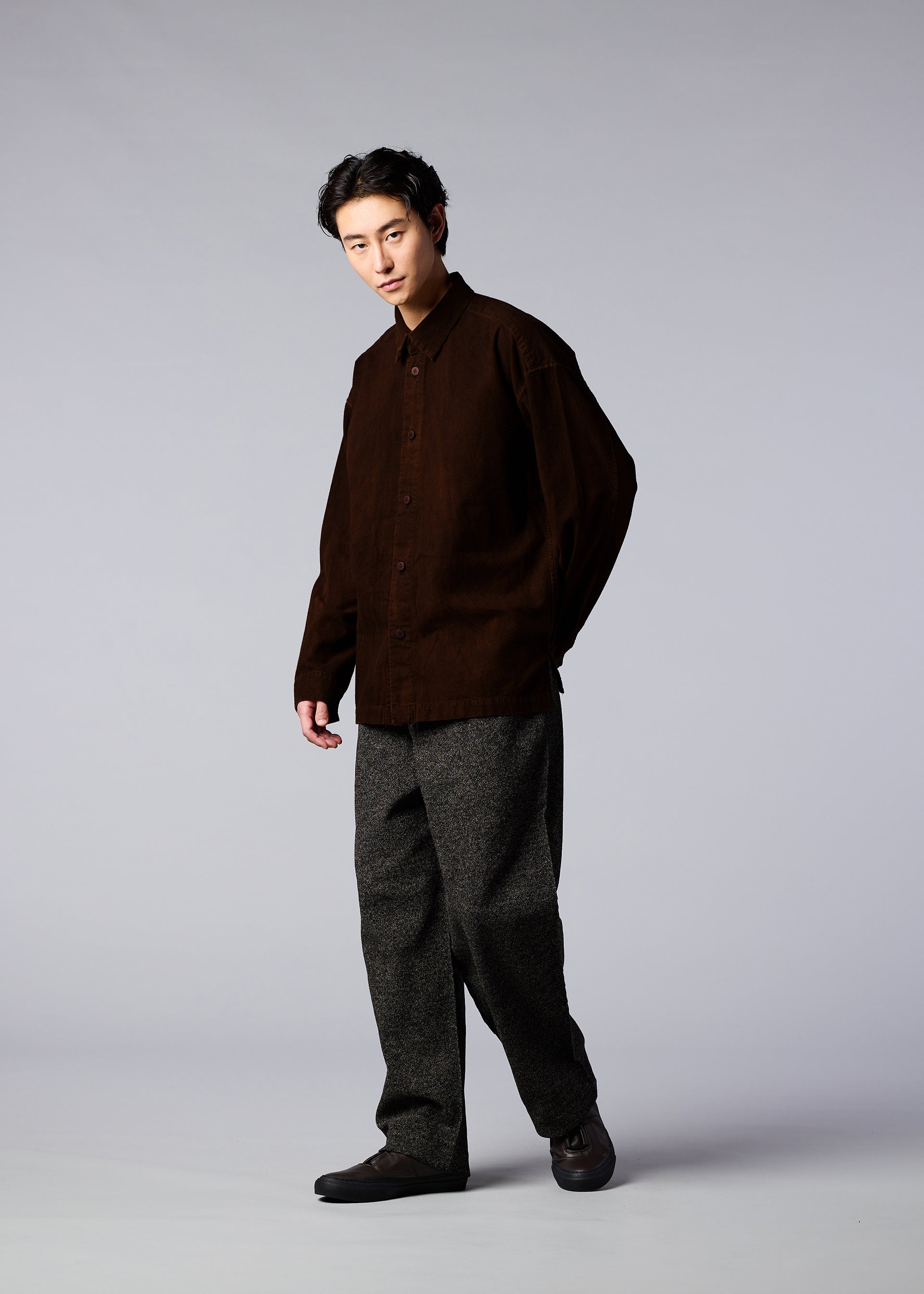 A model wears the IM MEN DOROZOME SHIRT shirt.