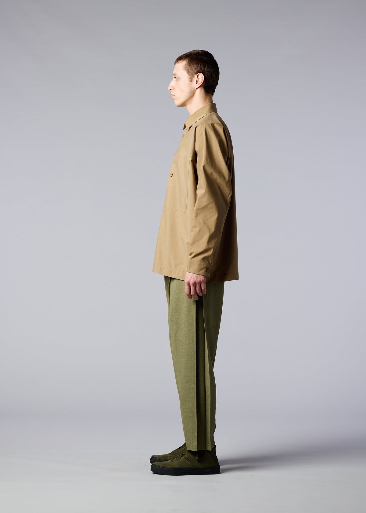 A model wears the IM MEN ONE CUT SHIRT shirt.