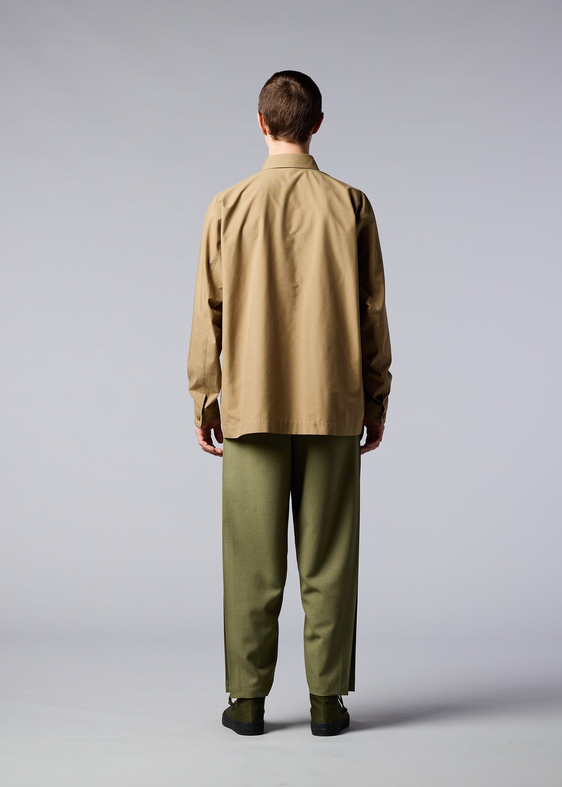 A model wears the IM MEN ONE CUT SHIRT shirt.