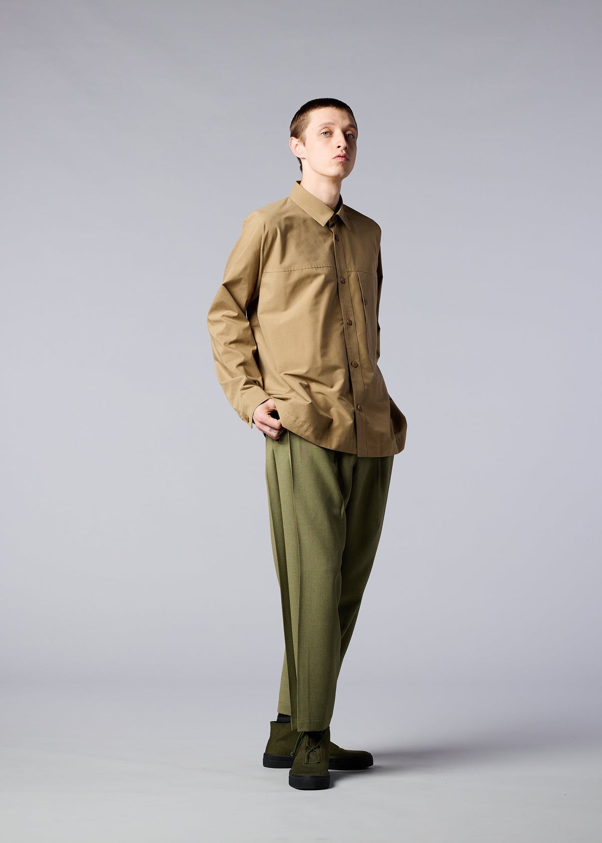A model wears the IM MEN ONE CUT SHIRT shirt.