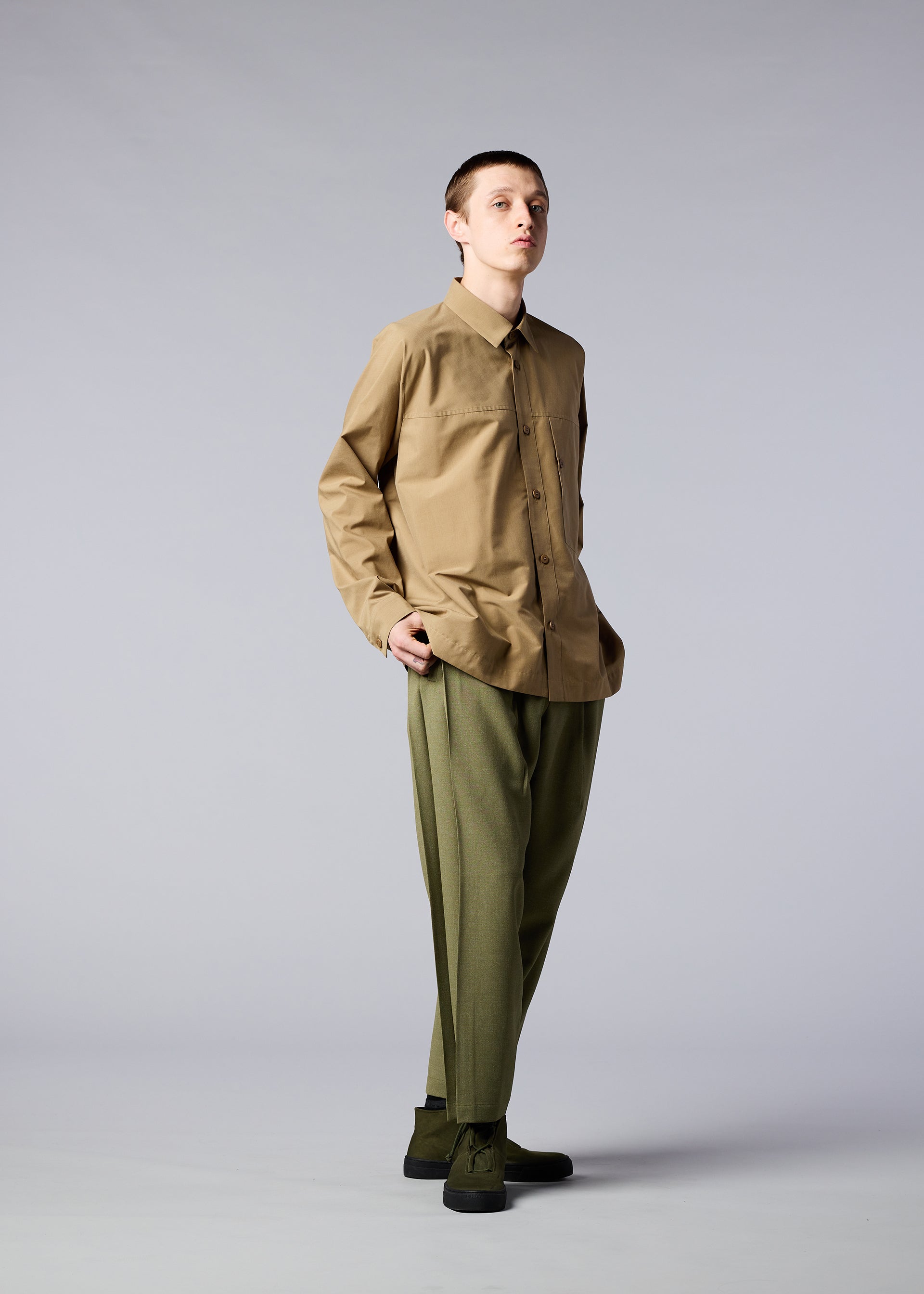 A model wears the IM MEN ONE CUT SHIRT shirt.