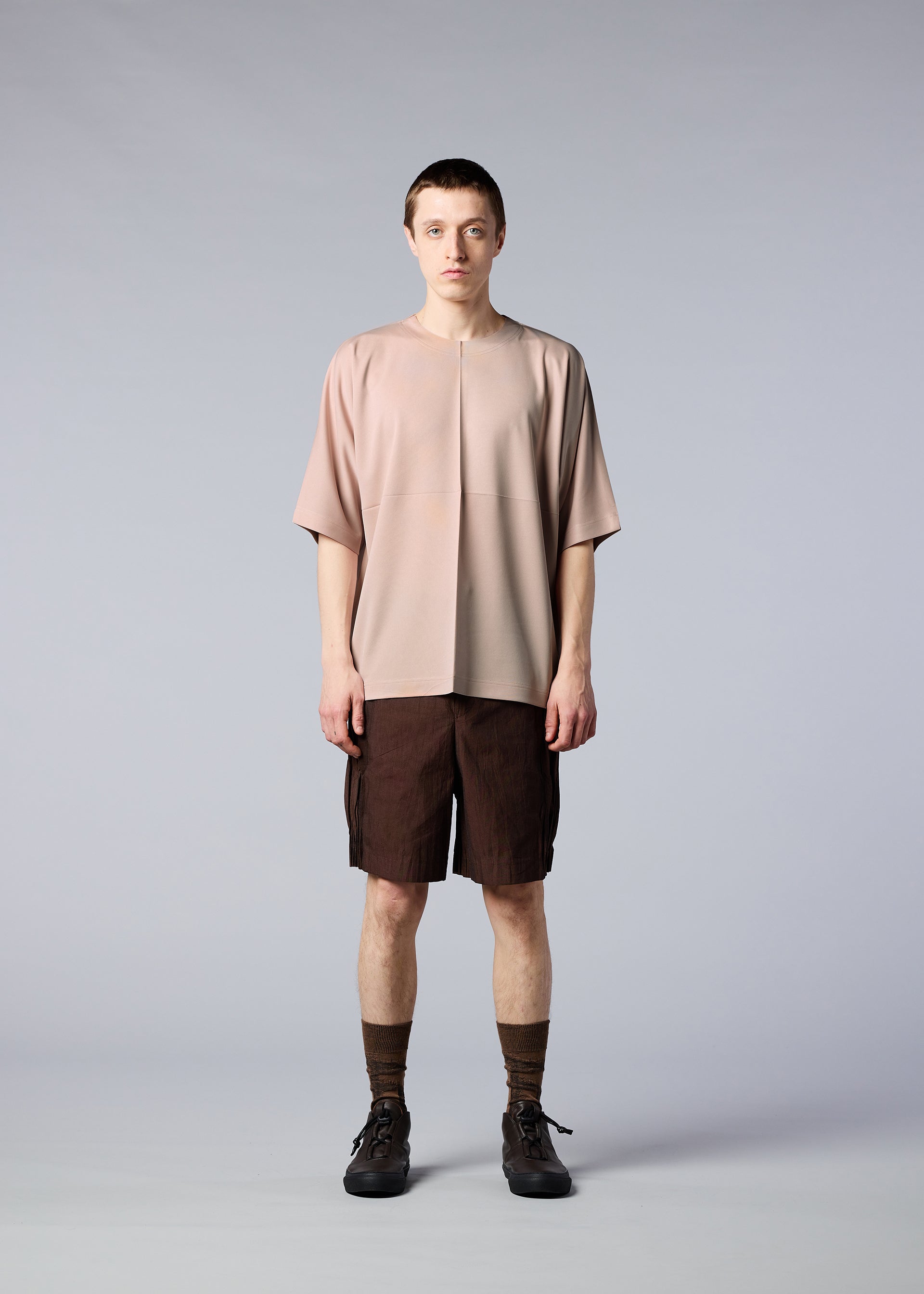 A model wears the IM MEN FLAT T top