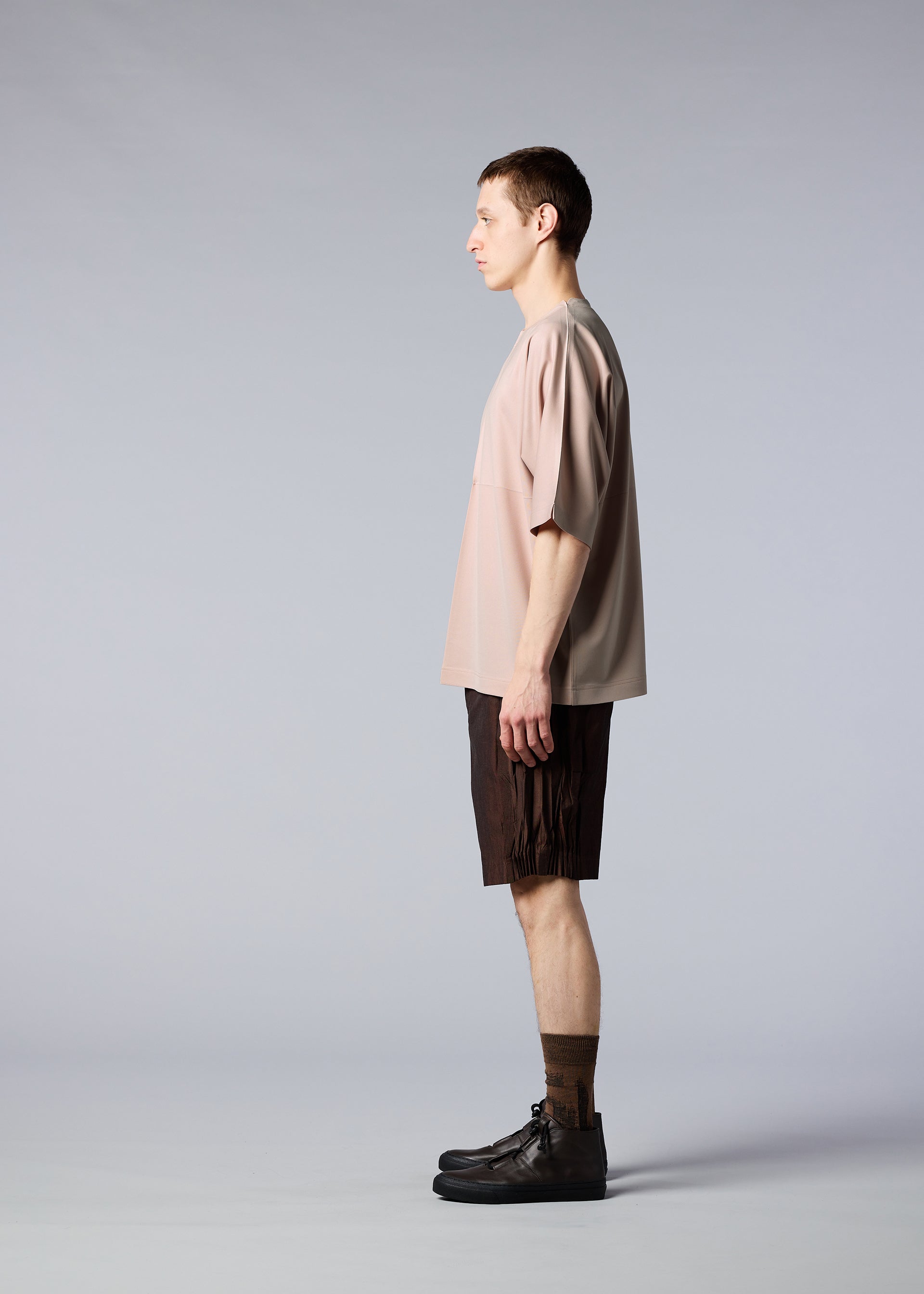 A model wears the IM MEN FLAT T top