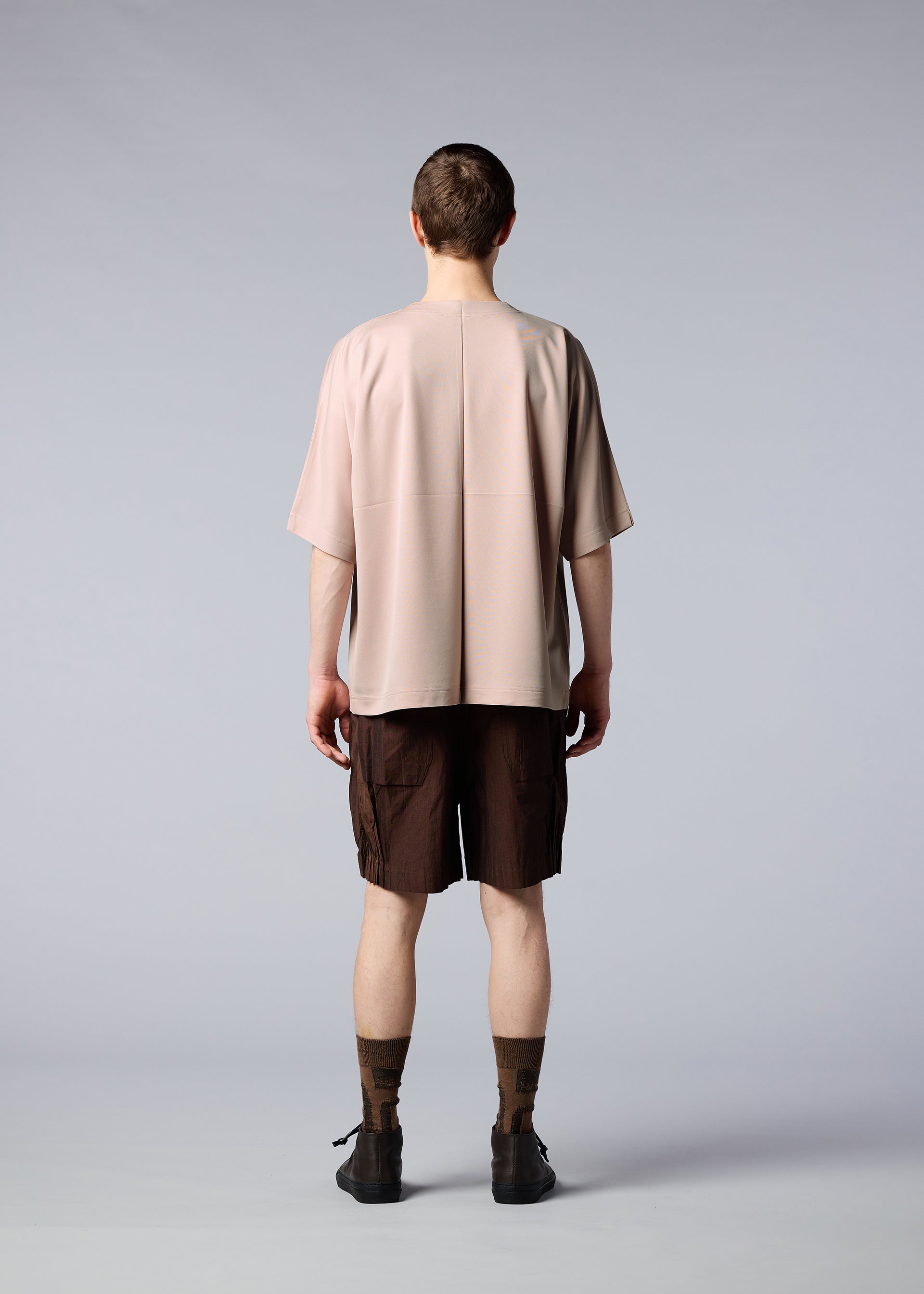 A model wears the IM MEN FLAT T top